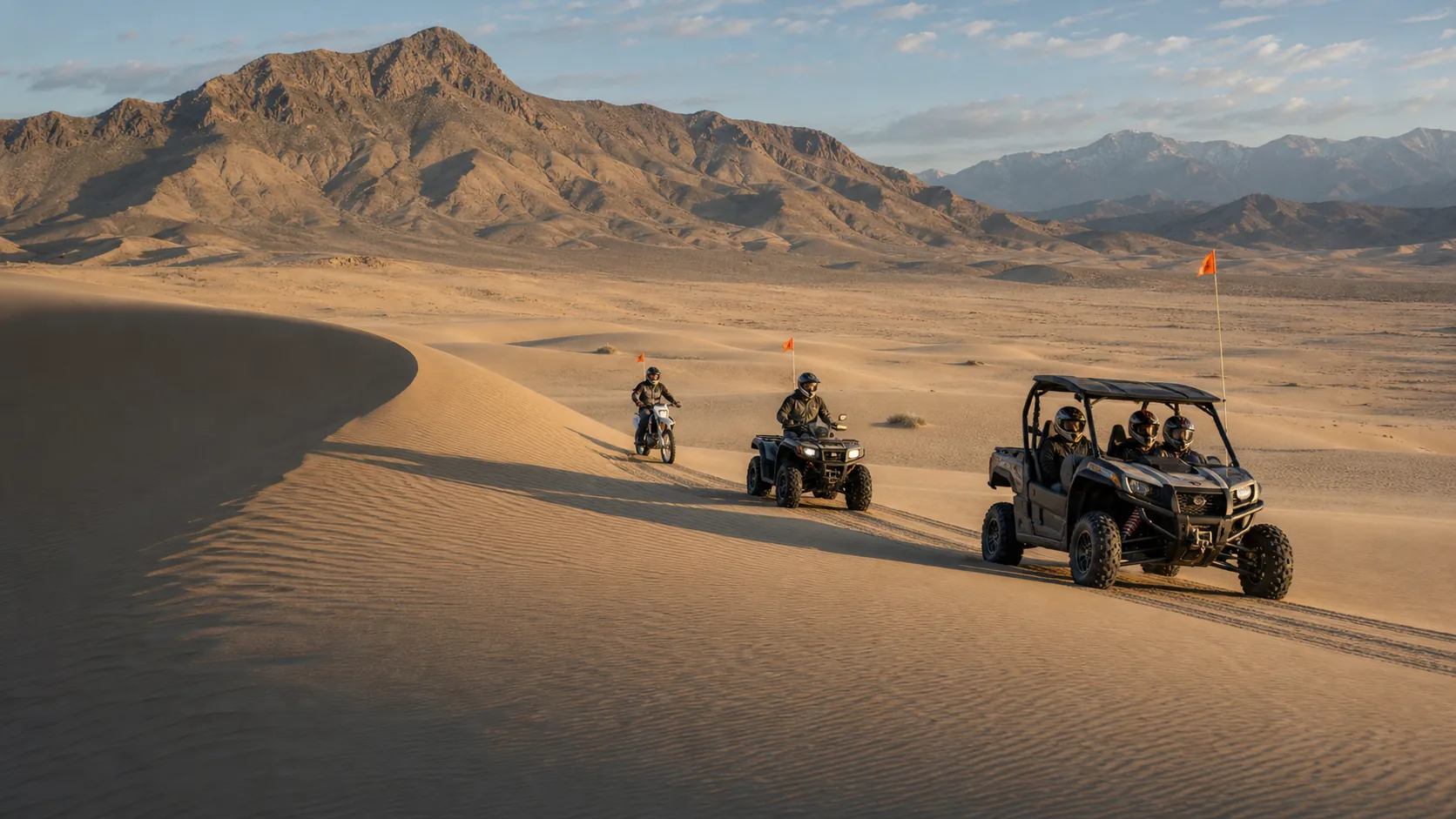Helmeted riders in Little Sahara dune country